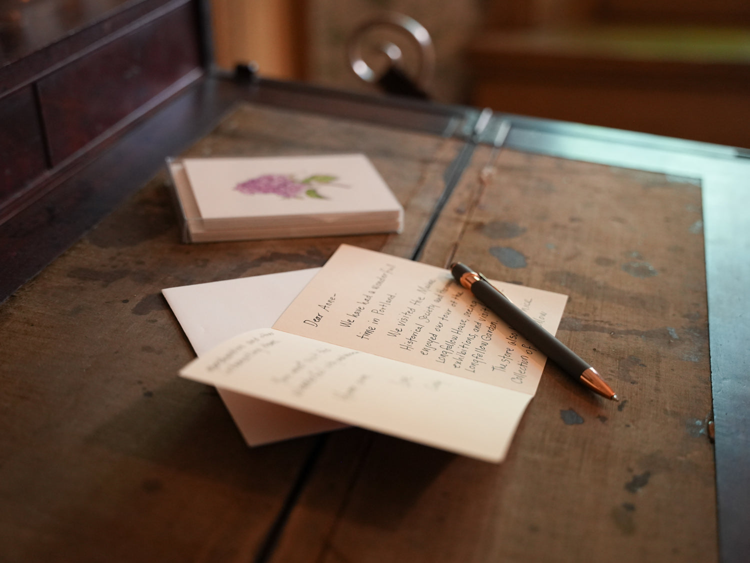 hand written card and pencil on desk